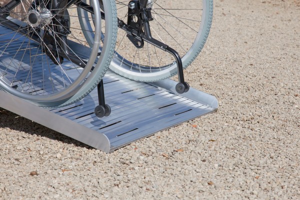 a picture of manual wheelchair wheels on a ramp