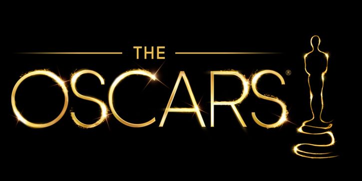 an Oscar statue that is hidden in the shadows is outlined in gold next to gold lettering that says the Oscars