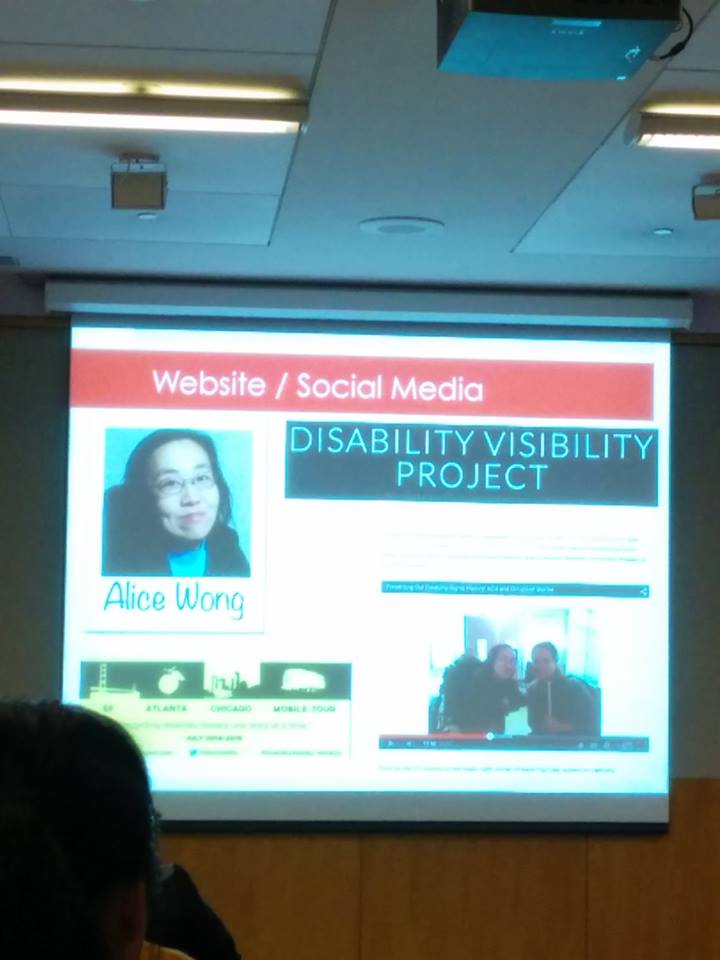 A picture of a projection screen shows a picture of Alice in one corner, from shoulders up, an Asian woman, wearing glasses with shoulder length dark hair, and the words Disability Visibility Project are next to that